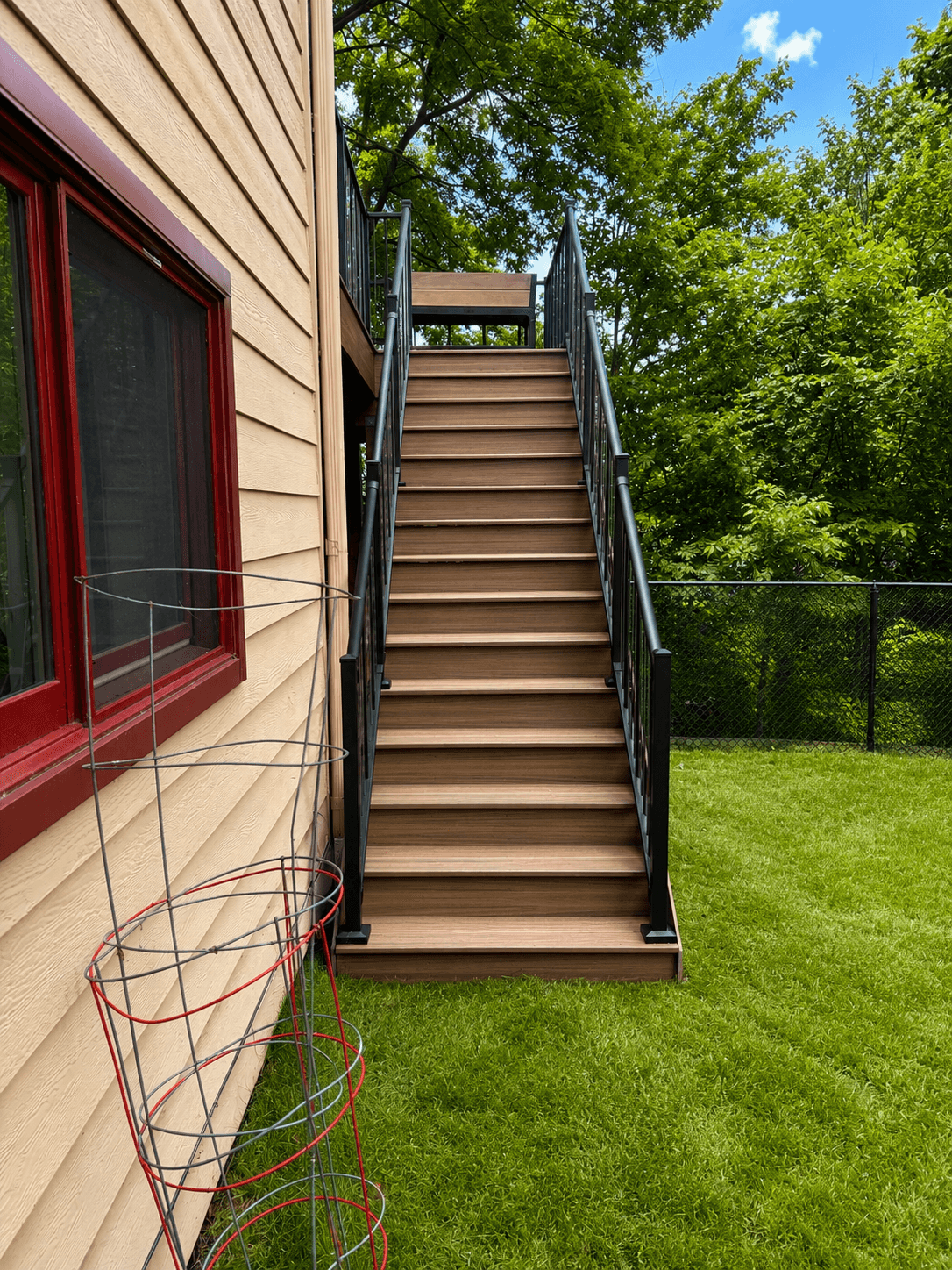 Finished Bloomington backyard deck with stairs and railings