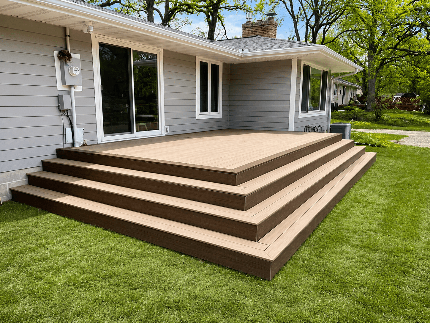 Finished Trex composite deck with wide steps by All-Pro Decks and Patios